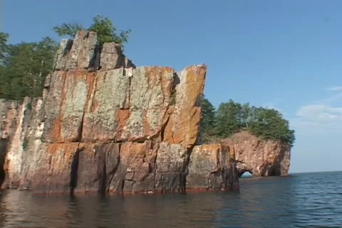 Boat pov sharp cliff, far cave Stock Footage 192549649