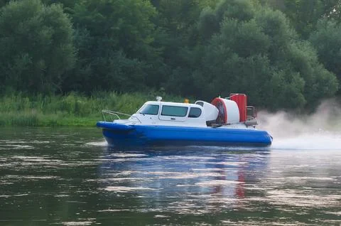 Boat with propeller moves down river Stock Photos