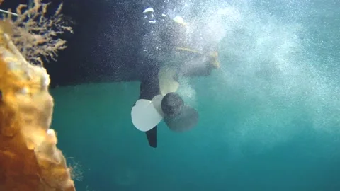 Boat propeller underwater. Preparing for work, launch. starts spinning. back vie Stock Footage 145714864