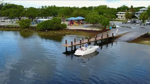 Boat Pull Out and Away from Marina Dock Video stock 79447012