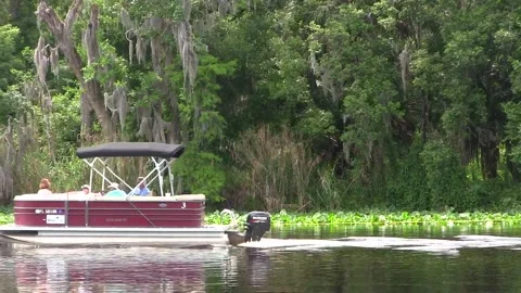 Boat pulling a boat. on the saint johns river . Stock Footage 152592469
