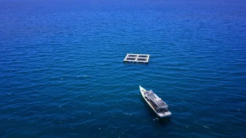 Boat Pulling Fish Cage - Traditional Fishing Technique in Indonesia. Drone Sh Stock Footage 113533362