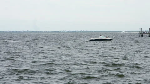 Boat pulling in from the ocean during the summer Stock Footage 64903684