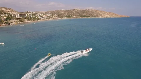 BOAT PULLS INFLATABLE DAY Stock Footage 96154739