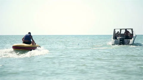 The boat pulls a man in the circle on the sea Video stock 65164842