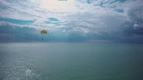 Boat pulls the parachute tandem Stock Footage