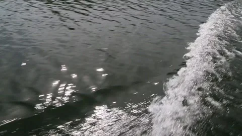 The boat quickly floats on the river and creates waves Stock Footage 86225524