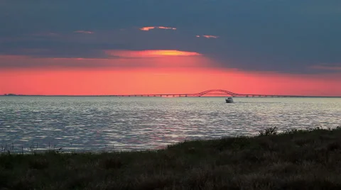 Boat Racing across ocean during sunset Stock Footage 44019883