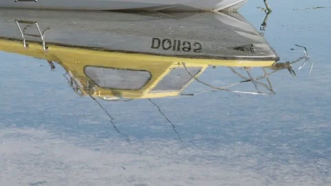 Boat reflection in water Stock Footage 245525592