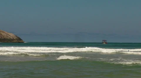 A Boat off of the Remote Beach Lagoinha do Leste Stock-Footage 33726457