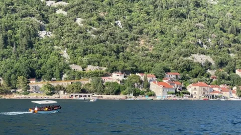 A boat rests gently on the tranquil surface of the waterway Stock Footage 280088373