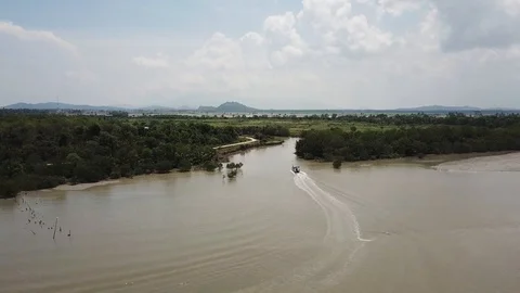 A boat reverse the direction near the river mouth. Stock Footage 118074422