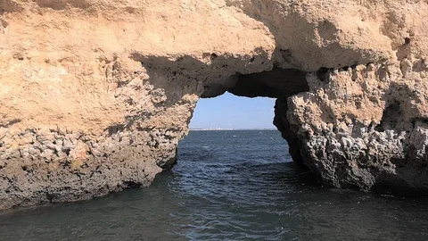 Boat ride between rocks towards the open sea Stock-Footage 98315364