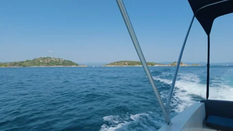 A boat ride on clear blue waters near Diaporos Island in the Halkidiki region of Stock Footage 346673717