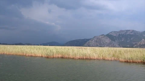 Boat ride in Dalyan with dramatic clouds Stock Footage 277354734