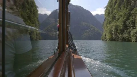 Boat ride on the lake with the mountain view in summer time Stock Footage 82284530
