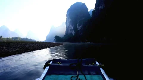 Boat ride on a misty river surrounded by karst mountains Stock Footage 311818982