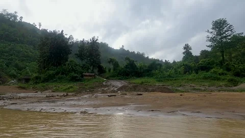 Boat ride in muddy stream between green mountains Stock Footage 273635726