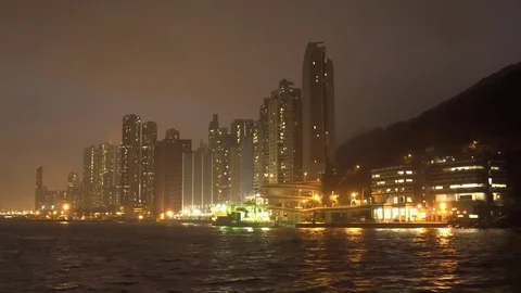 Boat ride with night view of high rise buildings Video stock 72909898