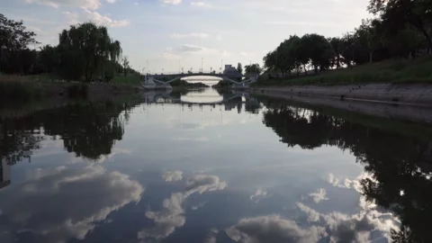 Boat ride on the River with reflections of the sky in the water, 4k Stock Footage 308662619