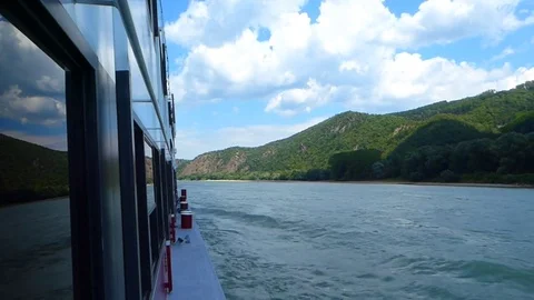 Boat ride with sky reflectiong windows on river Danube Stock Footage 81304062