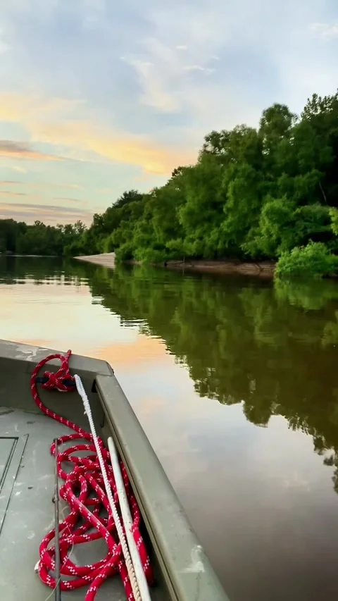 Boat Ride at Sunset on Calm River with Reflections Stock Footage 320186738