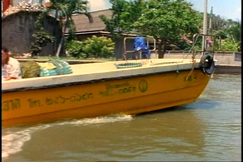 Boat ride through canals (klongs) of Bangkok, POV, pass boat moving fast Stock Footage 868614