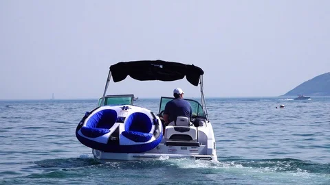 A boat rides out into the ocean Stock Footage 91284399