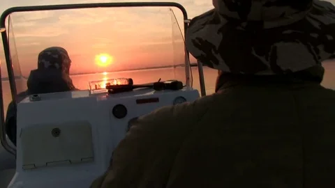 Boat is riding towards the sunset Video stock 70917946