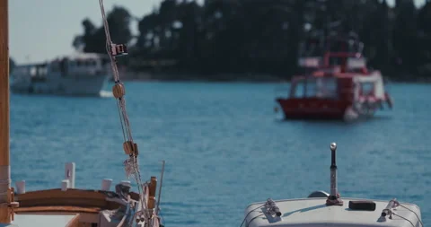 Boat rigging and rope with blurred red boat in background Video stock 334339154