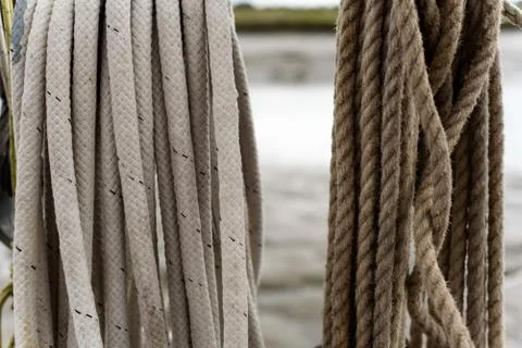 Boat rigging rope tied in a loop with a mixture of new and worn roping. Stock Photos