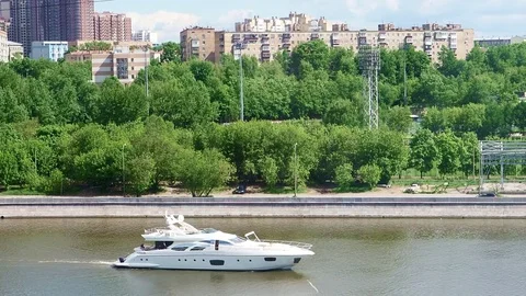 The boat is on the river in the city Stock Footage 82951888