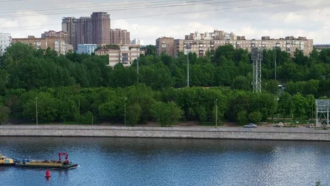 The boat is on the river in the city Stock Footage 82952217