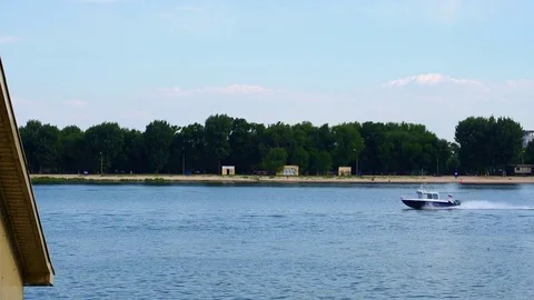 The boat is on the river in the city Stock Footage 82992676