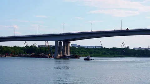The boat is on the river in the city Stock Footage 82993268