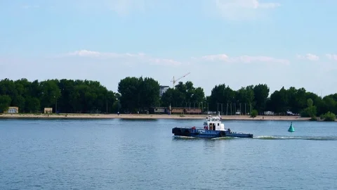 The boat is on the river in the city Stock Footage 82993661