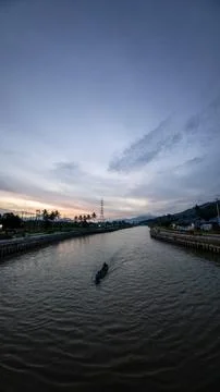 Boat on River at Dusk Stock Photos
