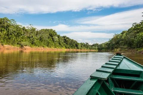 Boat in the river in the peruvian amazon jungle at madre de dios peru Stock Photos