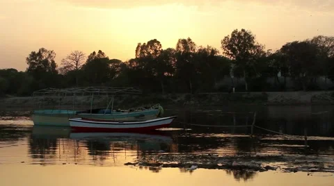 A boat in river Ravi while sunsets Stock Footage 46973508