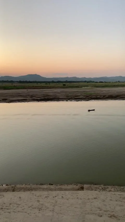 Boat on a river at sunset in Bagan Vídeos de archivo 343736284