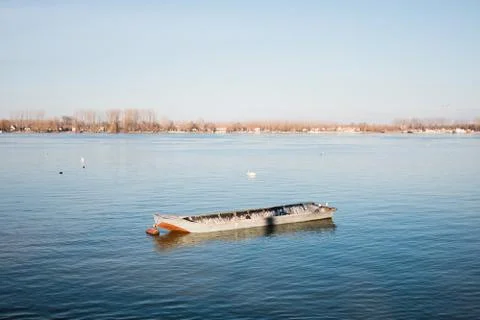 Boat in the river in sunset light Stock Photos