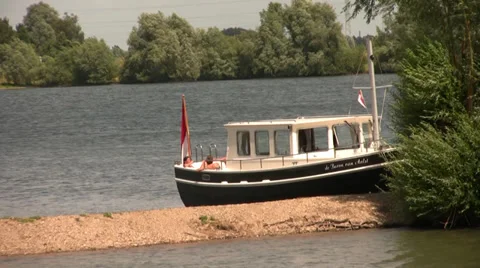 Boat at riverbank Stock Footage 39814763