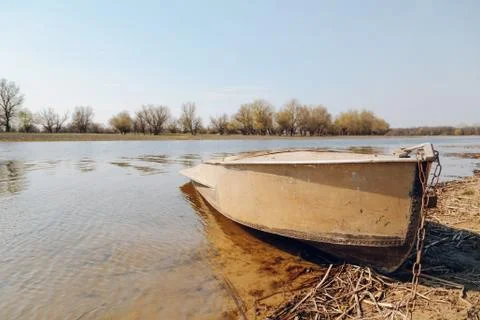 Boat at the riverside Stock Photos
