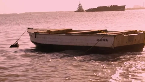 Boat Rocking on Waves at Sunset Video stock 136768506