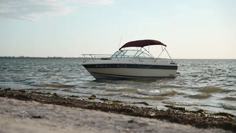 Boat rocking in the wind at beach Stock-Footage 194959755