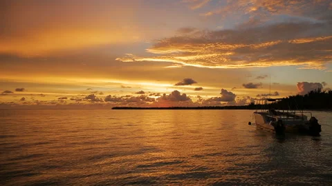 The boat rocks on the waves in the rays of the sunset Stock Footage 90757128