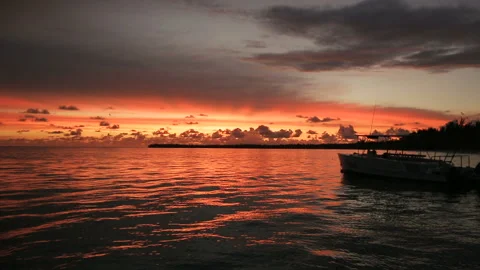 The boat rocks on the waves in the rays of the sunset Stock Footage 90801607
