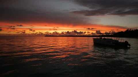 The boat rocks on the waves in the rays of the sunset Stock Footage 90801616