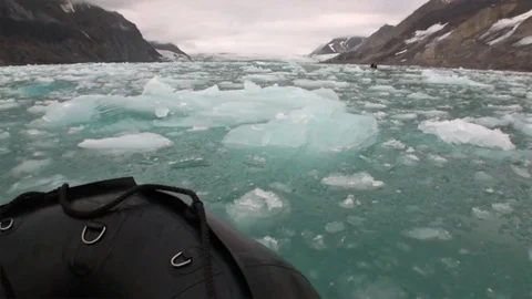 Boat sail on background Moving Ice Floes of Arctic Ocean in Svalbard. Video stock 74905131