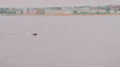 The boat is sailing along the river 스톡 동영상 327984817